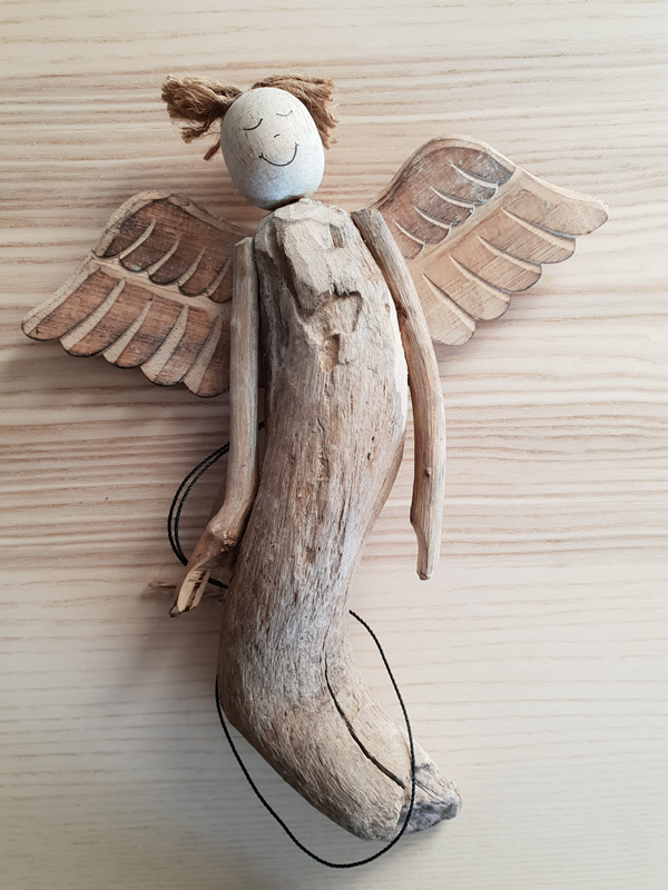 Wooden bali angels craftsmen handmade organic christmas sally bourne interiors london